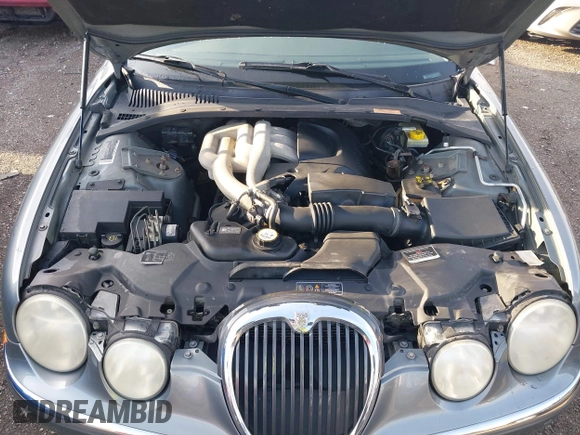 2003 Jaguar S-Type with VIN SAJEA01T23FM93839, listed as a IAAI auction lot 41891973 with 153,761 mi miles and . Bid and sale history available at DreamBid. Image 10.