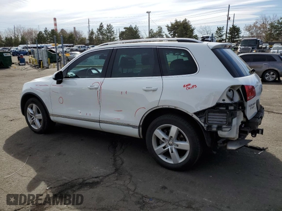 2012 Volkswagen Touareg с VIN WVGEG9BP1CD007581, выставлен на аукционе Copart как лот 47958355 с пробегом 79 649 миль миль и Списание • Salvage title. История ставок и продаж доступна на DreamBid. Изображение 2.