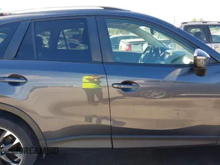 2016 Mazda CX-5 Grand Touring with VIN JM3KE2DY9G0824196, listed as a IAAI auction lot 41801887 with 88,625 mi miles. Bid and sale history available at carsss.com. Image 14.