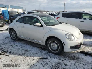 2012 Volkswagen Beetle 2.5L w/Sun/Sound/Nav PZEV with VIN 3VWHP7AT3CM627340, listed as a Copart auction lot 42633385 with 115,862 mi miles and Salvage Title. Bid and sale history available at carsss.com. Image 4.