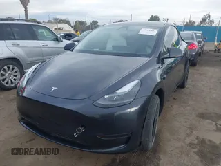 2024 Tesla Model Y with VIN 7SAYGDED8RF116209, listed as a IAAI auction lot 41761804 with 12,048 mi miles and . Bid and sale history available at DreamBid. Image 19.
