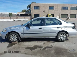 1999 Honda Civic LX with VIN JHMEJ6670XS000958, listed as a IAAI auction lot 41620949 with 93,698 mi miles and . Bid and sale history available at DreamBid. Image 14.