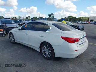 2014 Infiniti Q50 Sport with VIN JN1BV7AR7EM699663, listed as a IAAI auction lot 41532264 with 124,701 mi miles and . Bid and sale history available at DreamBid. Image 3.