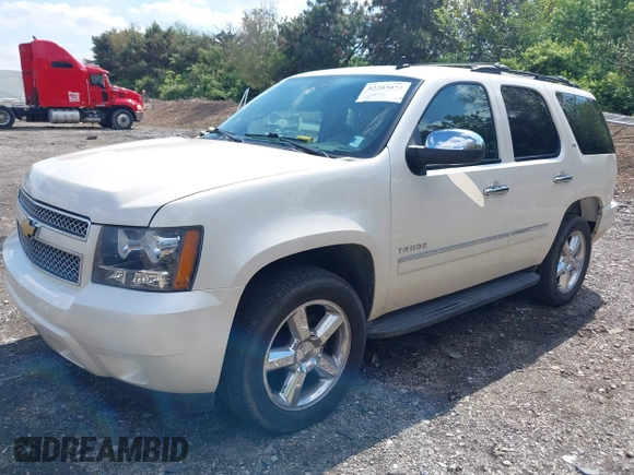 2013 Chevrolet Tahoe LTZ with VIN 1GNSKCE07DR326996, listed as a IAAI auction lot 42203073 with 147,067 mi miles and . Bid and sale history available at DreamBid. Image 17.