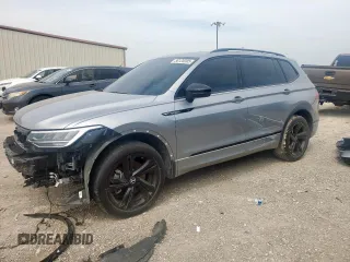 2023 Volkswagen Tiguan SE R-Line Black with VIN 3VVCB7AX5PM128335, listed as a Copart auction lot 56128305 with 21,524 mi miles and Salvage title. Bid and sale history available at DreamBid. Image 1.