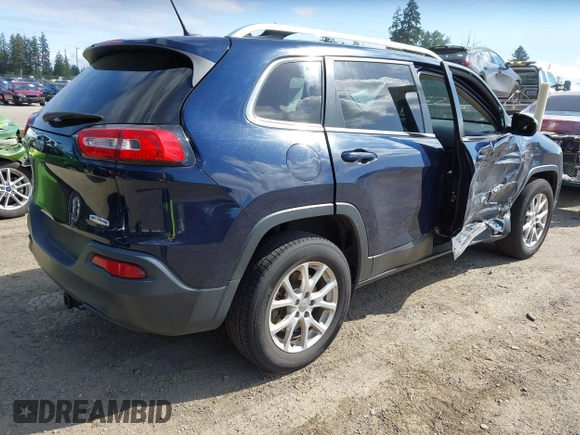 2015 Jeep Cherokee Latitude with VIN 1C4PJMCB0FW702535, listed as a IAAI auction lot 42149898 with 125,938 mi miles and . Bid and sale history available at carsss.com. Image 4.