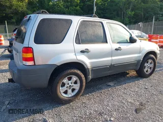 2006 Ford Escape XLT with VIN 1FMYU93156KD26045, listed as a IAAI auction lot 42503718 with 141,738 mi miles and . Bid and sale history available at DreamBid. Image 4.