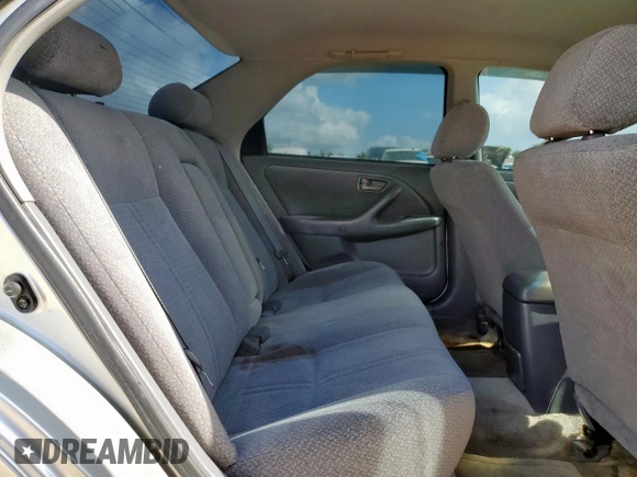 2000 Toyota Camry CE с VIN JT2BG22KXY0391368, выставлен на аукционе Copart как лот 59923575 с пробегом 220 660 миль миль и Списание • Salvage title. История ставок и продаж доступна на DreamBid. Изображение 10.