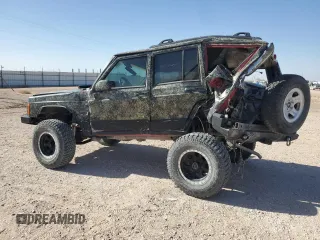 1999 Jeep Cherokee Sport with VIN 1J4FF68S6XL645028, listed as a Copart auction lot 48897255 with 218,552 mi miles and Salvage Title. Bid and sale history available at carsss.com. Image 2.