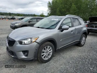 2014 Mazda CX-5 Touring z VIN JM3KE4CY0E0407169, wystawiony jako Copart lot #57877215 z przebiegiem 168 277 mil mil oraz Szkoda całkowita • Salvage title. Historia ofert i sprzedaży dostępna na DreamBid. Obrazek 1.