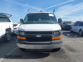 2014 Chevrolet Express Cargo Van with VIN 1GCWGFCB2E1122236, listed as a IAAI auction lot 41381131 with 70,696 mi miles. Bid and sale history available at carsss.com. Image 12.