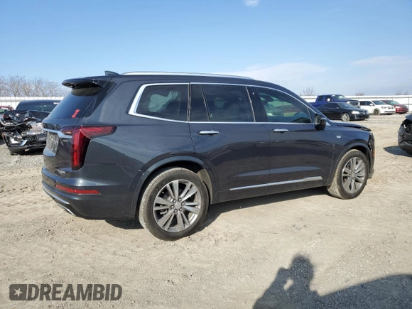 2021 Cadillac XT6 Premium Luxury z VIN 1GYKPCRS6MZ205831, wystawiony jako Copart lot #47259215 z przebiegiem 31 959 mil mil oraz Szkody całkowita. Historia ofert i sprzedaży dostępna na DreamBid. Obrazek 3.