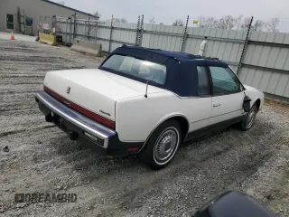 1987 Oldsmobile Toronado with VIN 1G3EZ1130HU307201, listed as a Copart auction lot 49290815 with 104,837 mi miles and Salvage Title. Bid and sale history available at DreamBid. Image 3.