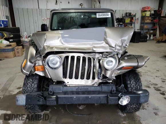 2004 Jeep Wrangler Sahara with VIN 1J4FA59S14P770952, listed as a Copart auction lot 66498694 with 112,649 mi miles and Salvage Title. Bid and sale history available at carsss.com. Image 5.