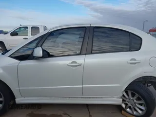 2009 Suzuki SX4 Man Sport FWD with VIN JS2YC414696201291, listed as a IAAI auction lot 41274116 with 120,233 mi miles. Bid and sale history available at carsss.com. Image 14.
