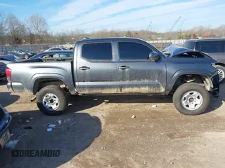 2023 Toyota Tacoma 4WD SR with VIN 3TMCZ5AN4PM582962, listed as a IAAI auction lot 41373504 with 34,138 mi miles. Bid and sale history available at carsss.com. Image 13.