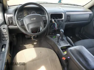 2004 Jeep Grand Cherokee Laredo with VIN 1J4GW48S64C291404, listed as a Copart auction lot 62835335 with 170,365 mi miles and Salvage title. Bid and sale history available at DreamBid. Image 8.