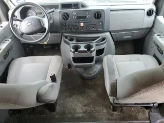 2014 Ford Econoline Passenger XL with VIN 1FBNE3BL4EDA25746, listed as a Copart auction lot 69606994 with 107,842 mi miles and Salvage Title. Bid and sale history available at carsss.com. Image 8.