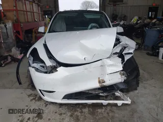 2023 Tesla Model Y Long Range z VIN 7SAYGAEEXPF789037, wystawiony jako IAAI lot #41551605 z przebiegiem 8 630 mil mil oraz . Historia ofert i sprzedaży dostępna na DreamBid. Obrazek 12.