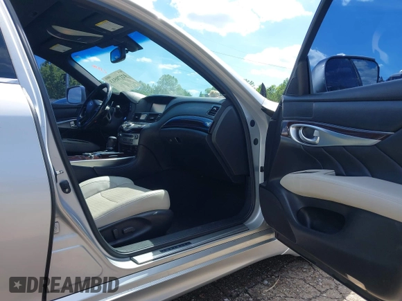 2013 Infiniti M with VIN JN1BY1AP0DM513527, listed as a IAAI auction lot 42170513 with 194,908 mi miles and . Bid and sale history available at DreamBid. Image 5.