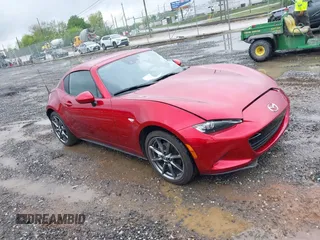 2020 Mazda MX-5 Miata Grand Touring z VIN JM1NDAM73L0411985, wystawiony jako IAAI lot #42127027 z przebiegiem 22 812 mil mil oraz . Historia ofert i sprzedaży dostępna na DreamBid. Obrazek 1.