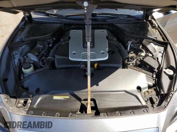 2015 Infiniti Q50 Premium z VIN JN1BV7ARXFM391291, wystawiony jako Copart lot #61765885 z przebiegiem 129 617 mil mil oraz Szkoda całkowita • Salvage title. Historia ofert i sprzedaży dostępna na DreamBid. Obrazek 11.