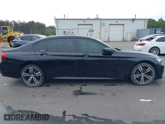 2019 BMW 7 Series 740i with VIN WBA7E2C57KB217973, listed as a IAAI auction lot 39064321 with 54,818 mi miles and . Bid and sale history available at DreamBid. Image 13.