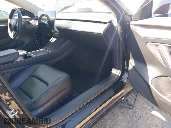 2021 Tesla Model 3 Long Range with VIN 5YJ3E1EB2MF065583, listed as a IAAI auction lot 42067399 with 52,333 mi miles. Bid and sale history available at carsss.com. Image 5.