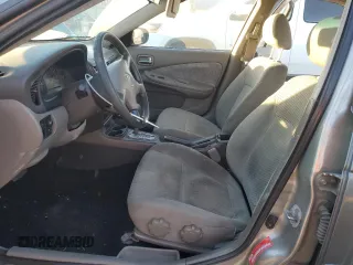 2000 Nissan Sentra XE with VIN 3N1CB51D3YL316712, listed as a Copart auction lot 84512254 with 228,070 mi miles and Salvage title. Bid and sale history available at DreamBid. Image 7.