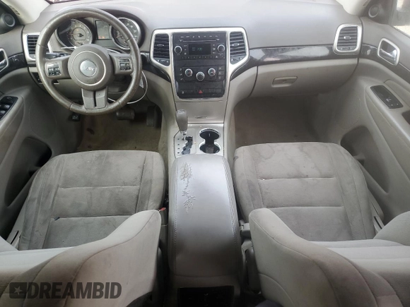 2011 Jeep Grand Cherokee Laredo with VIN 1J4RS4GG6BC704212, listed as a Copart auction lot 83753234 with 200,104 mi miles and Salvage Title. Bid and sale history available at DreamBid. Image 8.