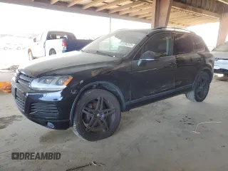 2011 Volkswagen Touareg Sport with VIN WVGFF9BP7BD001368, listed as a Copart auction lot 47263725 with 123,766 mi miles and Salvage Title. Bid and sale history available at DreamBid. Image 1.