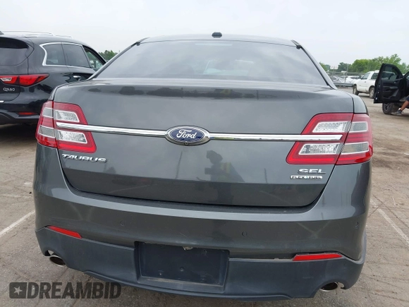 2015 Ford Taurus SEL z VIN 1FAHP2E81FG163058, wystawiony jako IAAI lot #42279778 z przebiegiem 127 957 mil mil oraz . Historia ofert i sprzedaży dostępna na DreamBid. Obrazek 16.