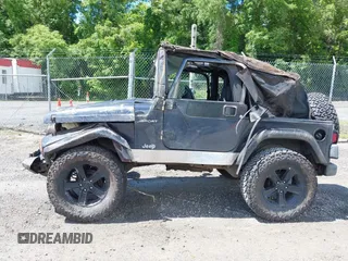 2003 Jeep Wrangler Sport z VIN 1J4FA49S53P317779, wystawiony jako IAAI lot #42388780 z przebiegiem Nie podano mil oraz . Historia ofert i sprzedaży dostępna na DreamBid. Obrazek 13.