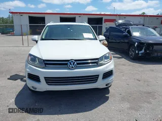 2012 Volkswagen Touareg Sport with VIN WVGEF9BP1CD008717, listed as a IAAI auction lot 42120641 with 211,580 mi miles and . Bid and sale history available at DreamBid. Image 12.