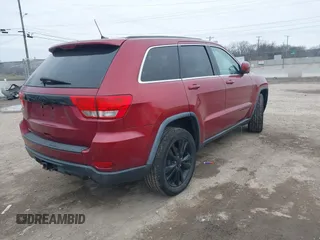 2013 Jeep Grand Cherokee Laredo with VIN 1C4RJEAG4DC573971, listed as a IAAI auction lot 41627288 with 143,256 mi miles. Bid and sale history available at carsss.com. Image 4.