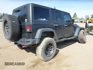 2015 Jeep Wrangler Unlimited Willys Wheeler with VIN 1C4BJWDG9FL750049, listed as a IAAI auction lot 42136188 with 115,328 mi miles and . Bid and sale history available at DreamBid. Image 4.