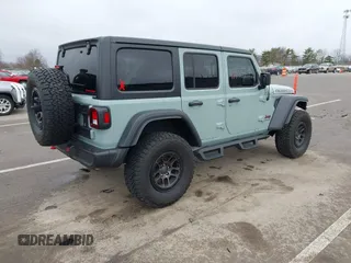 2023 Jeep Wrangler Rubicon with VIN 1C4JJXFG7PW654564, listed as a IAAI auction lot 41833534 with 22,277 mi miles and . Bid and sale history available at DreamBid. Image 4.