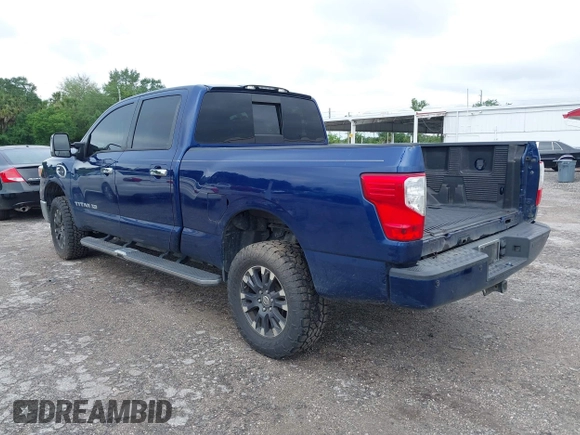 2019 Nissan Titan XD SV with VIN 1N6BA1F46KN514637, listed as a IAAI auction lot 41986617 with 123,872 mi miles. Bid and sale history available at carsss.com. Image 3.