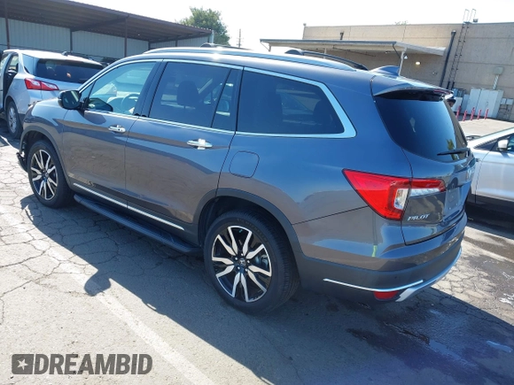 2021 Honda Pilot Touring 8-Passenger with VIN 5FNYF6H97MB034399, listed as a IAAI auction lot 42303419 with 50,034 mi miles and . Bid and sale history available at DreamBid. Image 3.