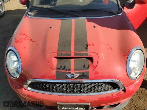 2013 MINI Roadster S z VIN WMWSY3C53DT566214, wystawiony jako Copart lot #83463854 z przebiegiem 69 877 mil mil oraz Szkoda całkowita • Salvage title. Historia ofert i sprzedaży dostępna na DreamBid. Obrazek 11.