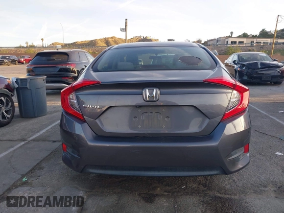 2016 Honda Civic Sedan LX with VIN 2HGFC2F55GH532108, listed as a IAAI auction lot 41860382 with 124,106 mi miles. Bid and sale history available at carsss.com. Image 16.