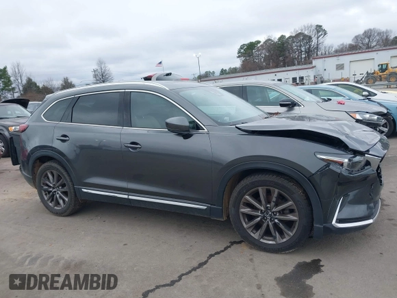 2016 Mazda CX-9 Grand Touring with VIN JM3TCADY4G0111310, listed as a IAAI auction lot 41532851 with 178,907 mi miles and . Bid and sale history available at DreamBid. Image 13.