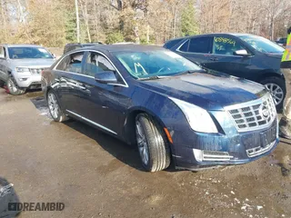 2015 Cadillac XTS Luxury with VIN 2G61N5S30F9196193, listed as a IAAI auction lot 40879852 with 87,416 mi miles. Bid and sale history available at carsss.com. Image 1.