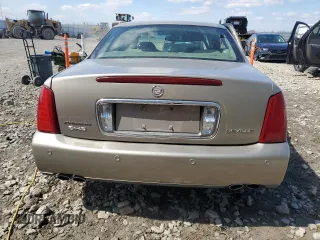 2002 Cadillac DeVille DHS z VIN 1G6KE57Y32U107755, wystawiony jako Copart lot #52811235 z przebiegiem 111 141 mil mil oraz Nie do naprawy. Historia ofert i sprzedaży dostępna na DreamBid. Obrazek 6.