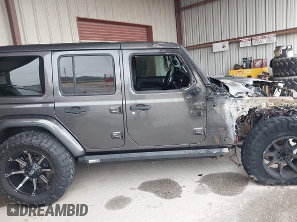 2019 Jeep Wrangler Unlimited Sahara with VIN 1C4HJXEG7KW661801, listed as a IAAI auction lot 40848731 with Not provided miles and . Bid and sale history available at DreamBid. Image 12.