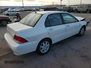 2002 Mitsubishi Lancer LS with VIN JA3AJ36E02U064779, listed as a Copart auction lot 86749184 with 127,343 mi miles and Salvage Title. Bid and sale history available at carsss.com. Image 3.