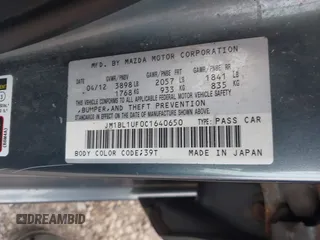 2012 Mazda Mazda3 i Sport with VIN JM1BL1UF0C1640650, listed as a IAAI auction lot 42019342 with 144,611 mi miles. Bid and sale history available at carsss.com. Image 9.