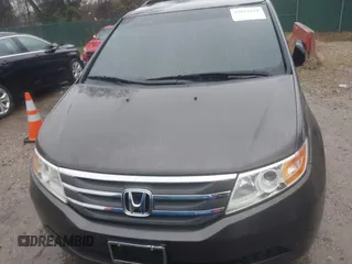 2012 Honda Odyssey EX-L with VIN 5FNRL5H6XCB057557, listed as a IAAI auction lot 42022410 with 174,286 mi miles and . Bid and sale history available at DreamBid. Image 12.