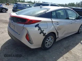 2018 Toyota Prius Plus with VIN JTDKARFP5J3091877, listed as a IAAI auction lot 42129355 with 48,736 mi miles and . Bid and sale history available at DreamBid. Image 4.