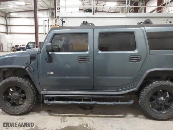 2005 Hummer H2 SUV with VIN 5GRGN23U65H132505, listed as a IAAI auction lot 41515346 with 140,944 mi miles. Bid and sale history available at carsss.com. Image 14.